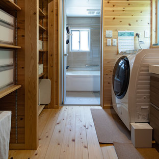 This is an example of a world-inspired galley utility room in Nagoya with open cabinets, medium wood cabinets, brown walls, light hardwood flooring, beige floors and white worktops.