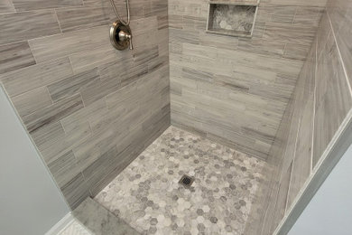 Bathroom - small contemporary gray tile and marble tile marble floor, white floor and single-sink bathroom idea in New Orleans with blue walls, marble countertops, a niche and a built-in vanity