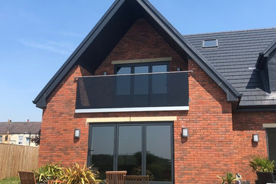Tinted, glass Juliet balcony, to match the contemporary look of this stunning ho