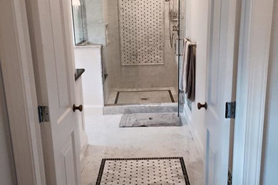 Inspiration for a large timeless master black and white tile, gray tile, white tile and stone tile marble floor corner shower remodel in Philadelphia with recessed-panel cabinets, white cabinets, granite countertops, a two-piece toilet, white walls and an undermount sink