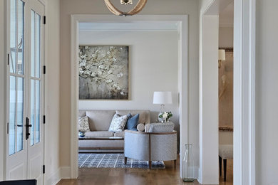 Inspiration for a mid-sized coastal medium tone wood floor living room remodel in DC Metro
