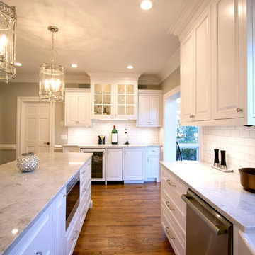 White Kitchen With Custom Bar and Large Island