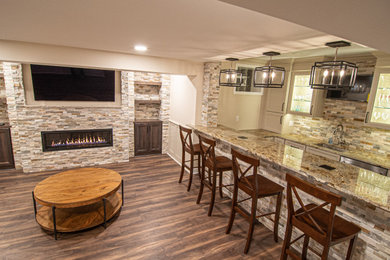 Basement Showing Warm Colors, Straight Lined Cabinets and Stacked Stone