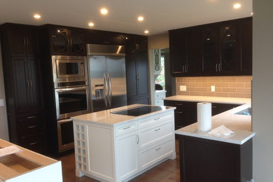 Transitional home design photo in Calgary
