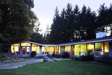 Mid-sized 1950s gray one-story wood exterior home idea in Bridgeport with a shingle roof