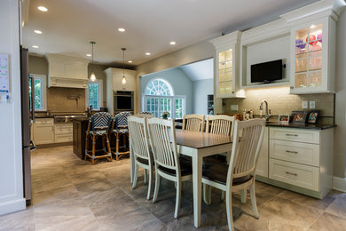 Mid-sized mountain style l-shaped porcelain tile and beige floor open concept kitchen photo in Bridgeport with an undermount sink, shaker cabinets, white cabinets, granite countertops, beige backsplash, porcelain backsplash, stainless steel appliances and an island
