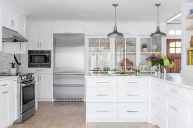 Eat-in kitchen - mid-sized modern porcelain tile and beige floor eat-in kitchen idea in New York with shaker cabinets, white cabinets, quartz countertops, gray backsplash, mosaic tile backsplash, stainless steel appliances, a peninsula and white countertops