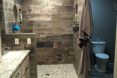 Inspiration for a rustic gray tile and porcelain tile porcelain tile double shower remodel in Minneapolis