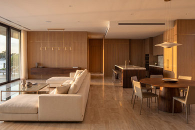 Example of a large trendy formal and open concept light wood floor, brown floor, tray ceiling and wood wall living room design in Miami with brown walls