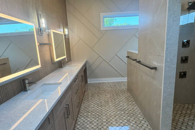 Trendy porcelain tile porcelain tile and double-sink bathroom photo with recessed-panel cabinets, a bidet, an undermount sink, quartz countertops, a hinged shower door and a built-in vanity