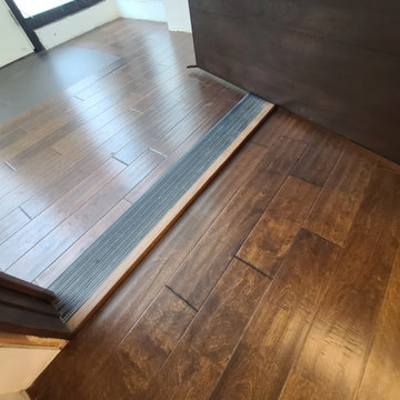 Sleek Engineered Hardwood & Modern Sliding Door by I’m The Man Services