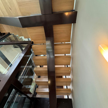 Project #136 | Modern Floating Staircase Encircling Glass Elevator