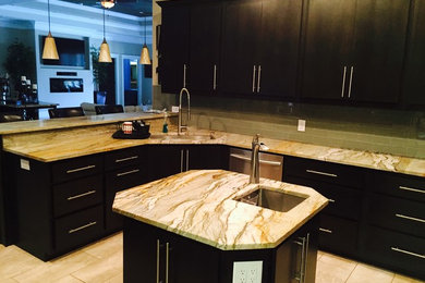 Eat-in kitchen - mid-sized contemporary l-shaped porcelain tile eat-in kitchen idea in Miami with a single-bowl sink, flat-panel cabinets, dark wood cabinets, granite countertops, green backsplash, glass tile backsplash, stainless steel appliances and an island