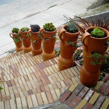 Front Yard with Artistic Driveway, Custom Sculptures, Planted Walls