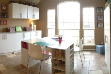 Example of a mid-sized trendy freestanding desk ceramic tile craft room design in Other with beige walls