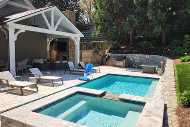 Patio - french country backyard stone patio idea in Atlanta with a fireplace