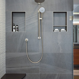 Large trendy master gray tile and ceramic tile pebble tile floor and multicolored floor bathroom photo in Seattle with flat-panel cabinets, medium tone wood cabinets, a two-piece toilet, blue walls, an undermount sink and quartz countertops
