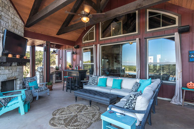 Patio - mid-sized farmhouse backyard tile patio idea in Austin with a fire pit and a roof extension