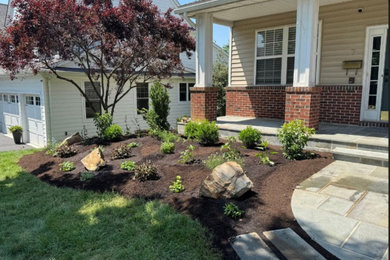 Design ideas for a traditional partial sun front yard concrete paver landscaping in Philadelphia.