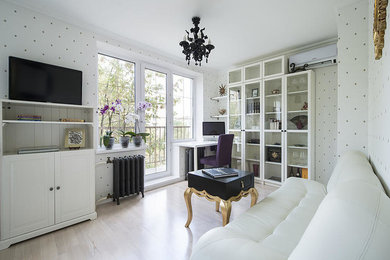 Traditional open concept living room in Moscow with a library, white walls and a wall-mounted tv.