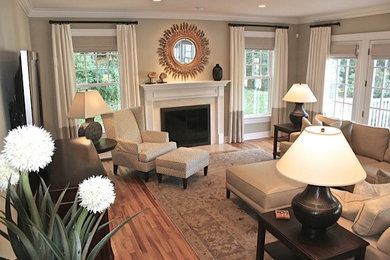 Large transitional open concept family room photo in New York with a tv stand