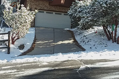 Inspiration for a modern front yard driveway in Other.