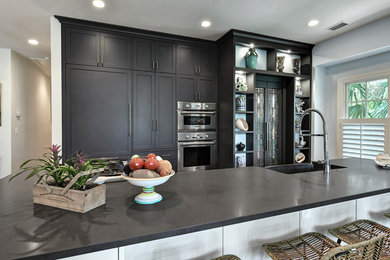 This is an example of a small transitional kitchen in Charleston.
