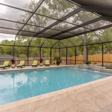 Patio with Fireplace with Screened Pool Enclosure