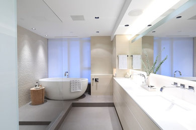 Design ideas for a large contemporary master bathroom in Vancouver with an undermount sink, flat-panel cabinets, light wood cabinets, quartzite benchtops, a freestanding tub, an open shower, a wall-mount toilet, multi-coloured tile, porcelain tile, multi-coloured walls and porcelain floors.
