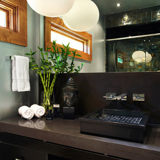 Example of a minimalist 3/4 ceramic floor alcove shower design in Other with flat-panel cabinets, an urinal, a vessel sink, granite countertops, a hinged shower door, brown cabinets and gray walls