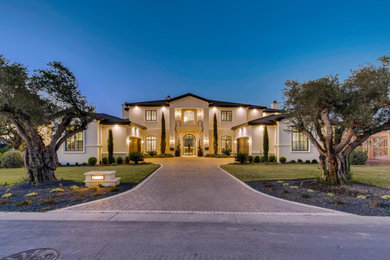 Example of a french country exterior home design in Austin