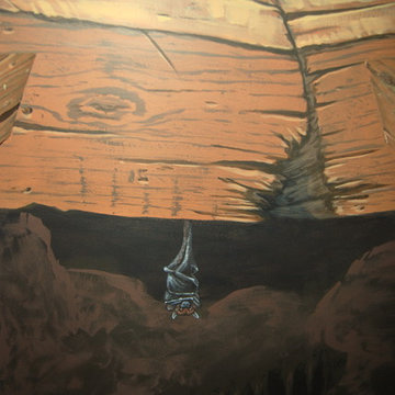 The Bat Cave Themed Mural in a stairway and lower level by Tom Taylor