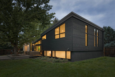 Example of a 1950s exterior home design in Denver