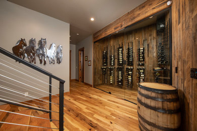 Inspiration for a rustic wine cellar remodel in Denver