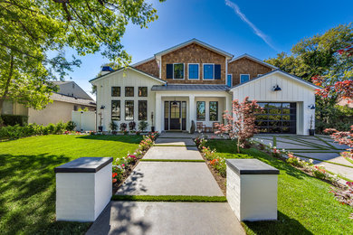 Mid-sized transitional multicolored two-story wood exterior home photo in Los Angeles with a shingle roof