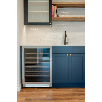 Modern Navy Wet Bar with Wine Cooler and Glass Cabinetry