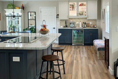 Mid-sized beach style wet bar photo in San Luis Obispo with an undermount sink, shaker cabinets, blue cabinets, quartzite countertops, multicolored backsplash and white countertops