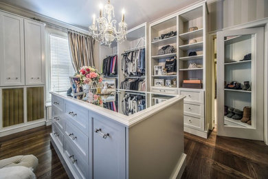 Design ideas for a large transitional gender-neutral dressing room in Boston with recessed-panel cabinets, white cabinets, dark hardwood floors and brown floor.