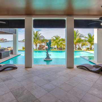 Resort-Style Pool House With Panoramic Waterfront Views