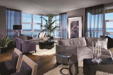 Living room - contemporary open concept dark wood floor living room idea in San Diego with gray walls, no fireplace and a wall-mounted tv
