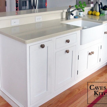 White Eclectic Kitchen with Two Tiered Peninsula