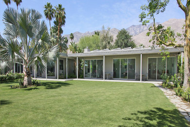 Example of a mid-sized 1950s beige one-story wood exterior home design in Los Angeles