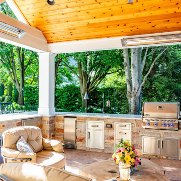 Pool Side Covered Patio with Fireplace and Bar Area
