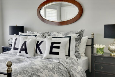 Bedroom - small coastal guest dark wood floor and brown floor bedroom idea in Phoenix with gray walls and no fireplace