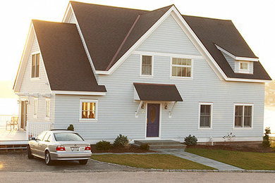 Example of a beach style home design design in Providence