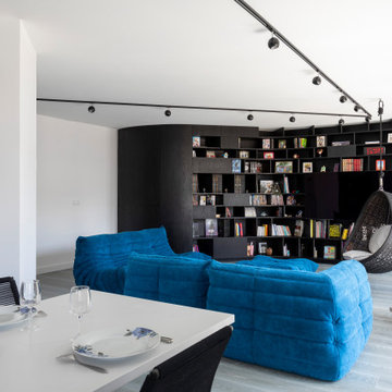 Une bibliothèque singulière dans une pièce de vie agrandie