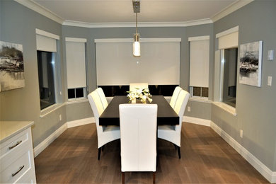 Design ideas for a mid-sized modern dining room in Vancouver with light hardwood floors and grey walls.