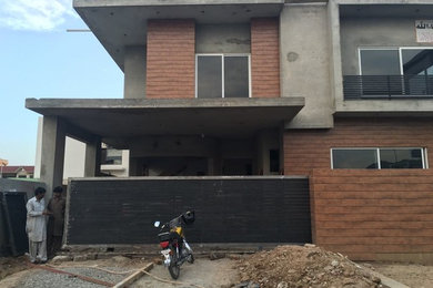 Home design - large contemporary home design idea in Other