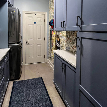 Laundry Room with Blue Painted Cabinetry and Sparkling White Quartz Countertops