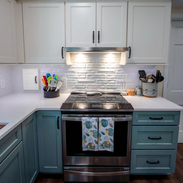 Custom Two-Toned Green and White Kitchen with Laventa Carrara Quartz Countertops